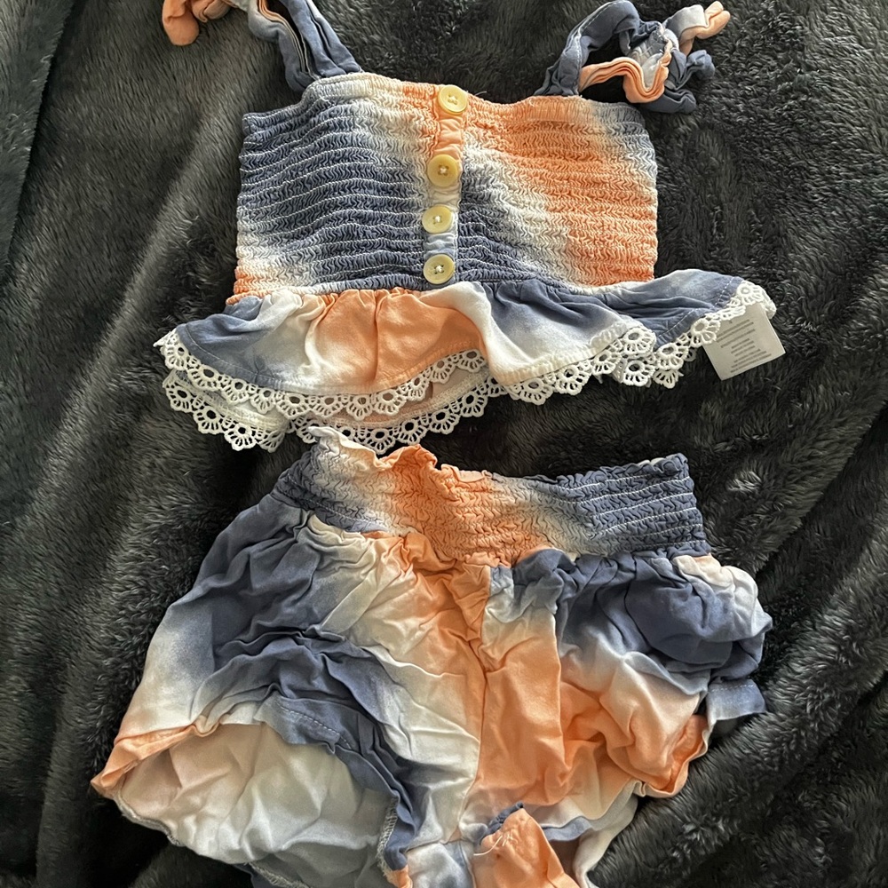 Cute little girl matching top and shorts